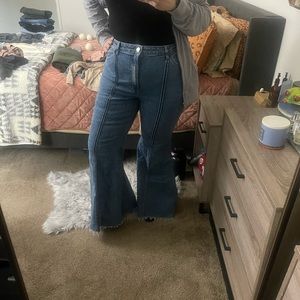 Bell bottom distressed hem jeans